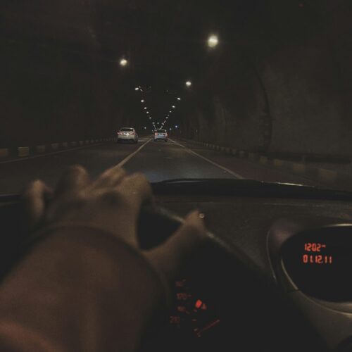 Woman's hand on steering wheel, showing driving anxiety before EMDR for accident trauma