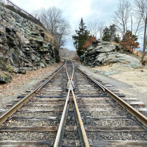 two train tracks coming together to symbolize marriage
