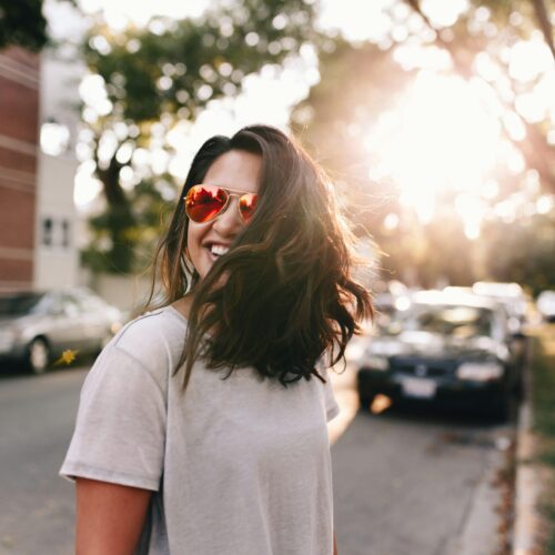 a happy philadelphia woman after going through breakup therapy