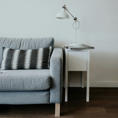Empty therapy office couch representing the safe space needed for PTSD treatment and EMDR sessions