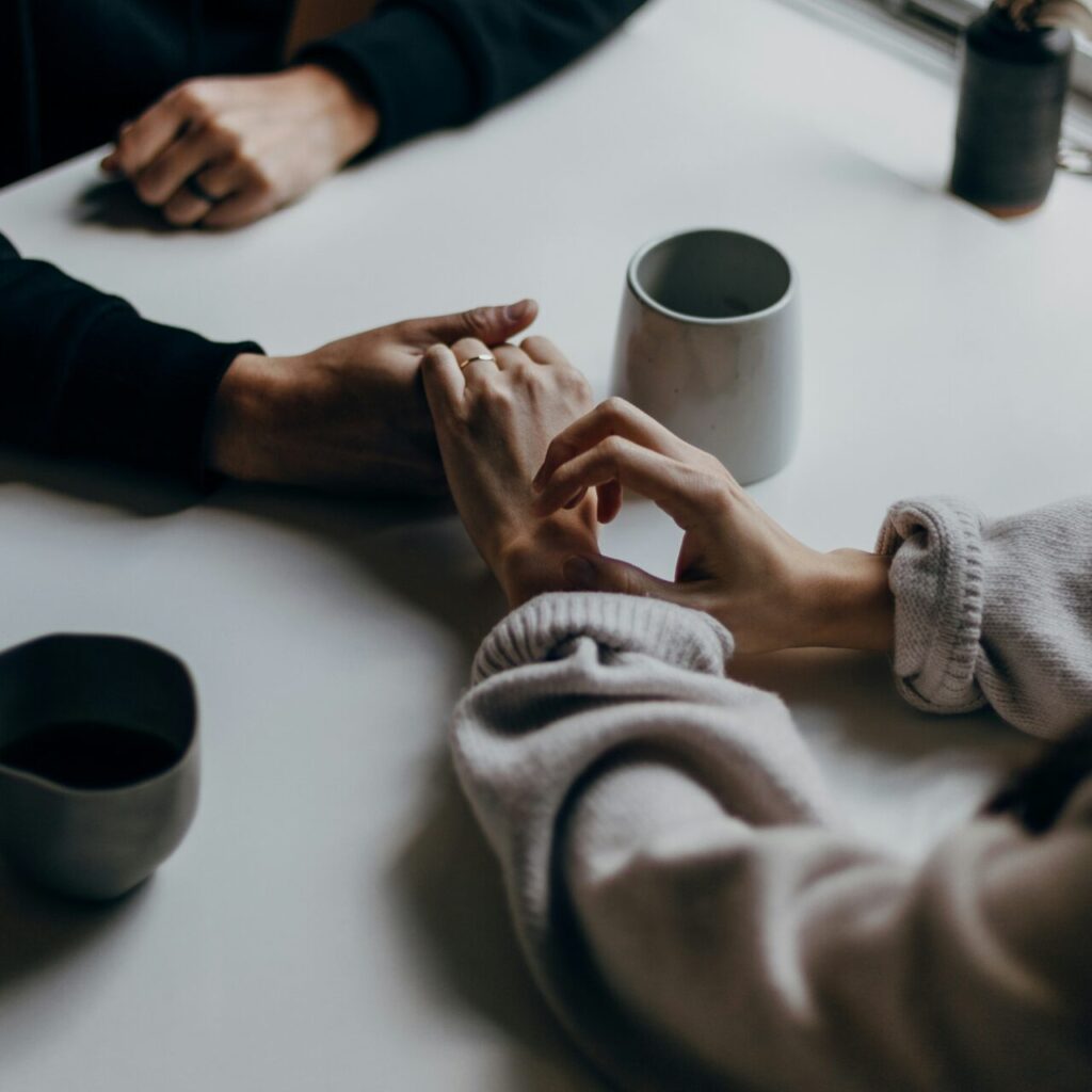 a woman talking to her partner about going to couples therapy