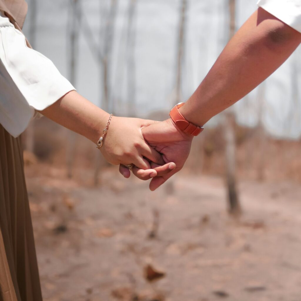 a couple holding hands after couples therapy