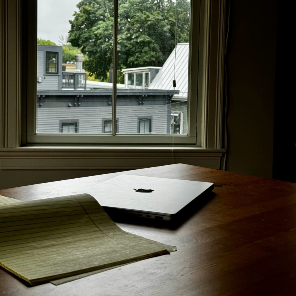 a laptop at an empty desk symbolizing being too depressed to work