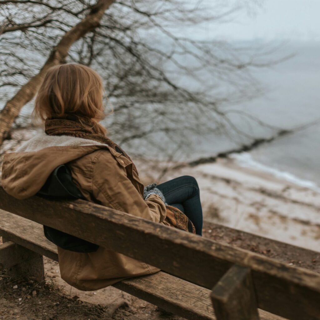 a philadelphia woman sitting on a bench wondering if she is depressed