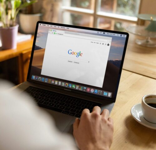 a person googling health anxiety therapy in philadelphia with a cup of coffee next to them