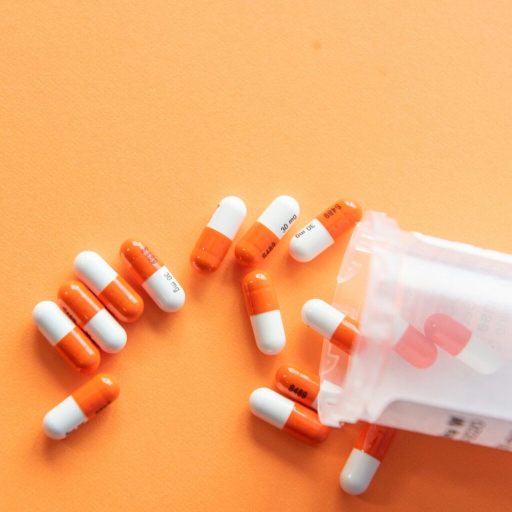 meds on a table representing if someone should take medication or therapy first for depression
