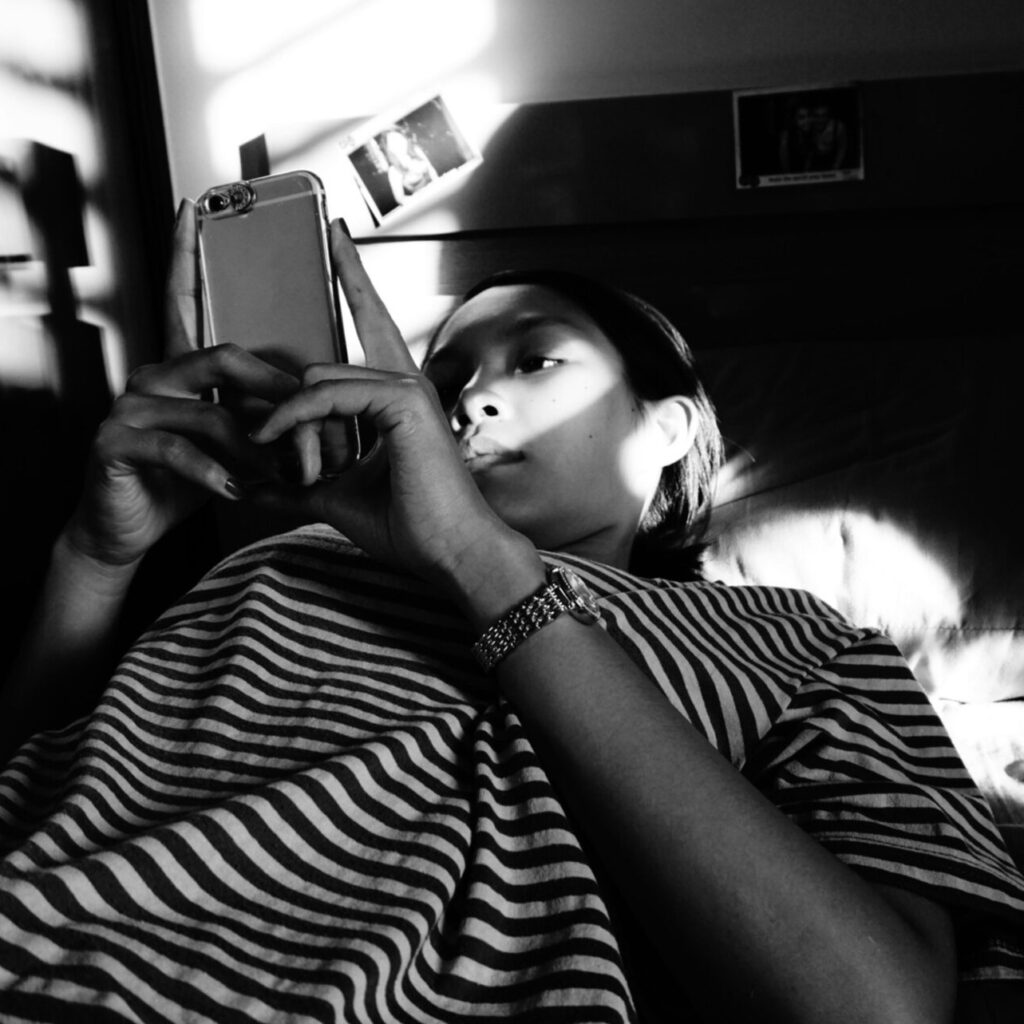 a struggling woman still in bed due to depression looking for coping skills